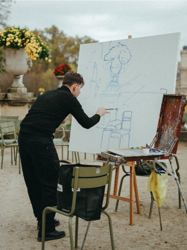 Artist Sergiu Ciochină painting en plein air in Jardin du Luxembourg, Paris